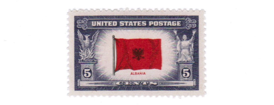 In 1943 the United States Post Office paid tribute to 13 countries occupied by Axis powers in the Overrun Countries Series. The Albania stamp, issued on November 9, 1943, depicts the flag of Albania.